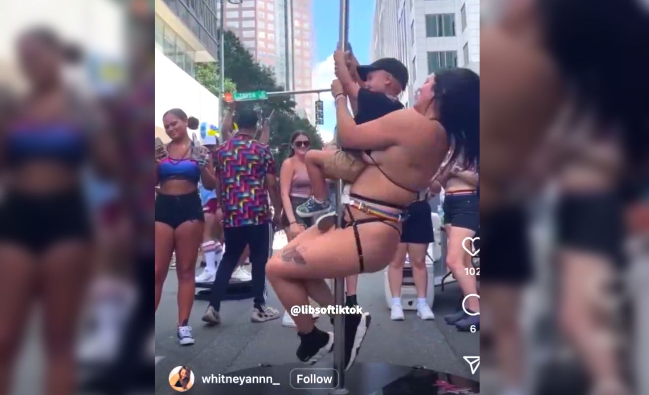 A young boy was seen holding onto a stripper pole with a scantily-clad woman at North Carolina's gay pride event, many claim "child abuse."