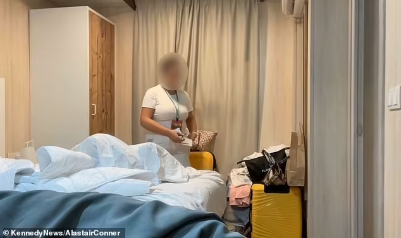 A cleaner was caught stashing valuables in her bra while cleaning a British family's room at a four-star hotel in Benidorm.